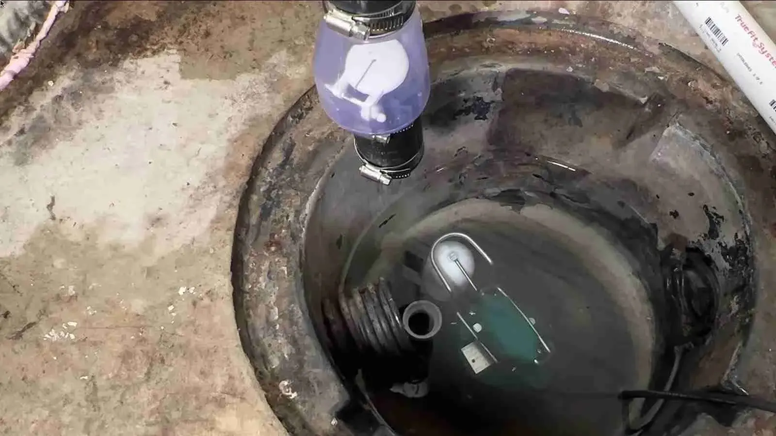 Sump pump installed in a basement pit