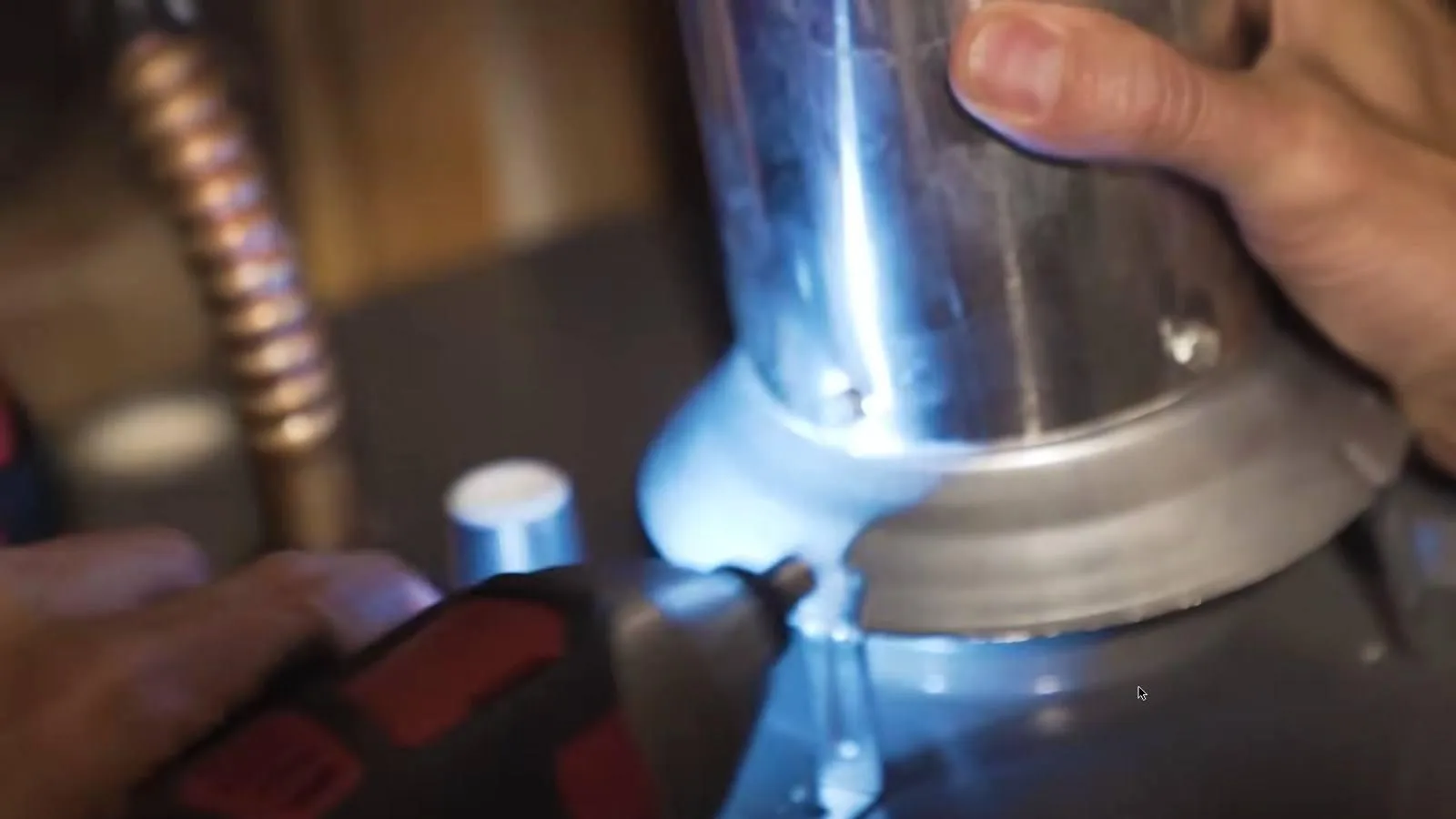 Drilling the vent connection during a water heater installation