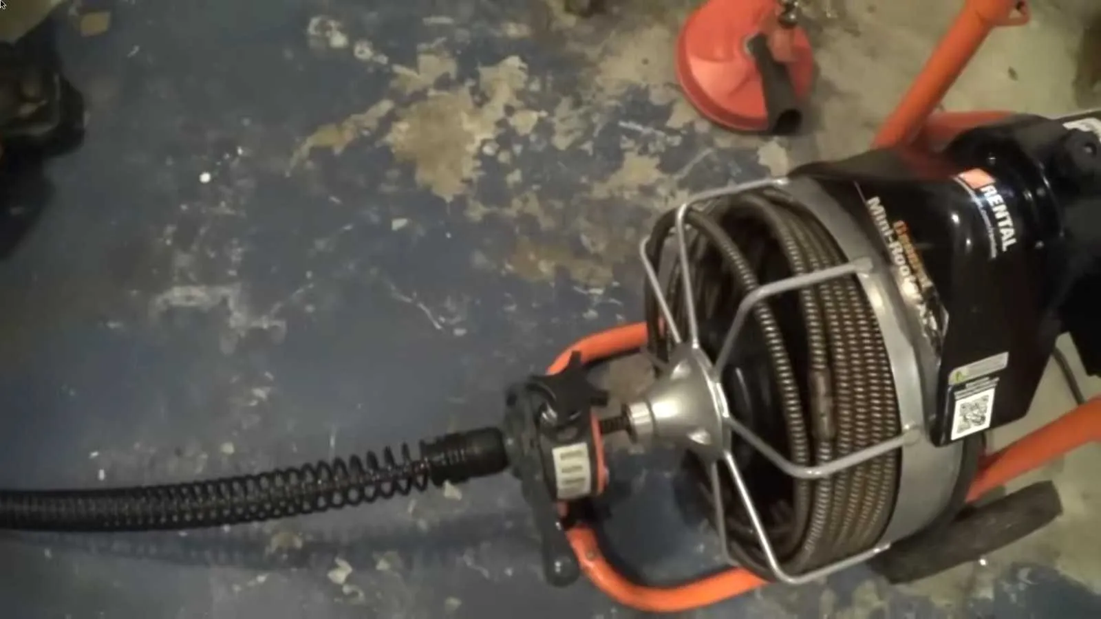 Drain machine cable feeding into a clogged line