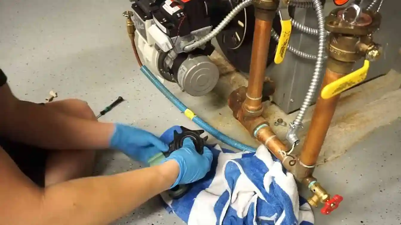 Removed circulator pump set aside during a boiler repair