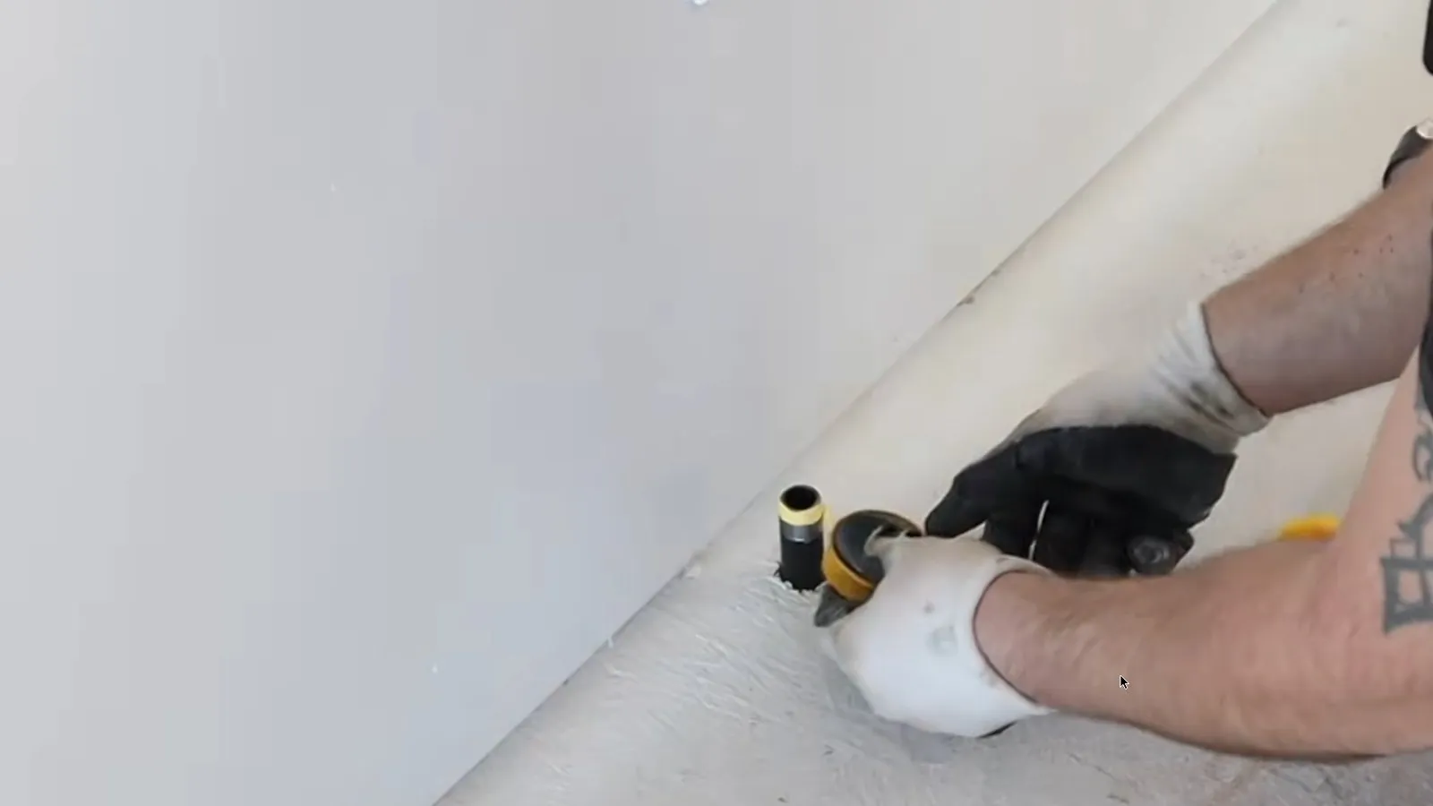 Black iron gas stub-out fitted through a floor