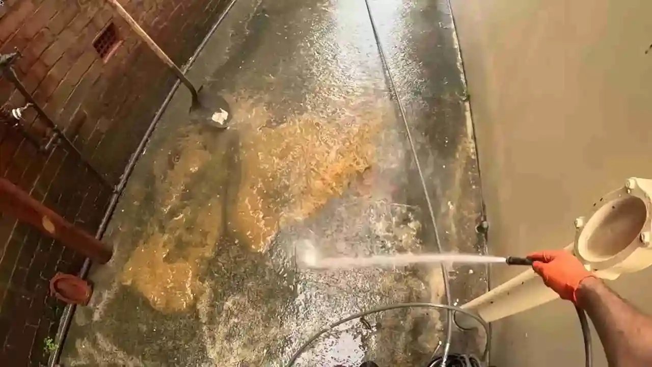 High-pressure hydro jetting spray inside a sewer line