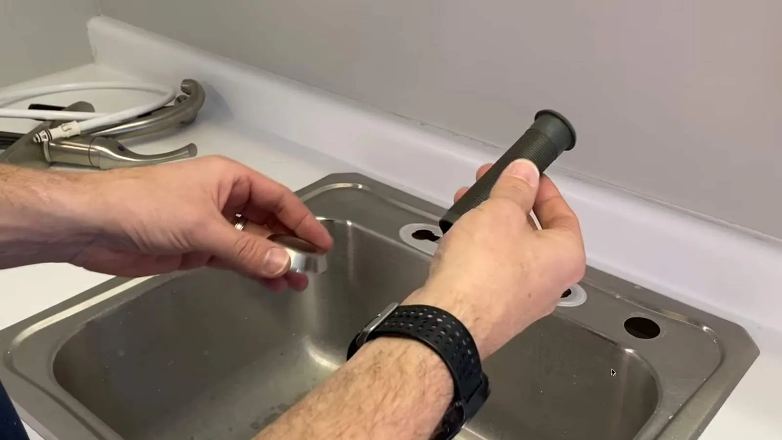 New faucet mounting hardware tightened from above the sink