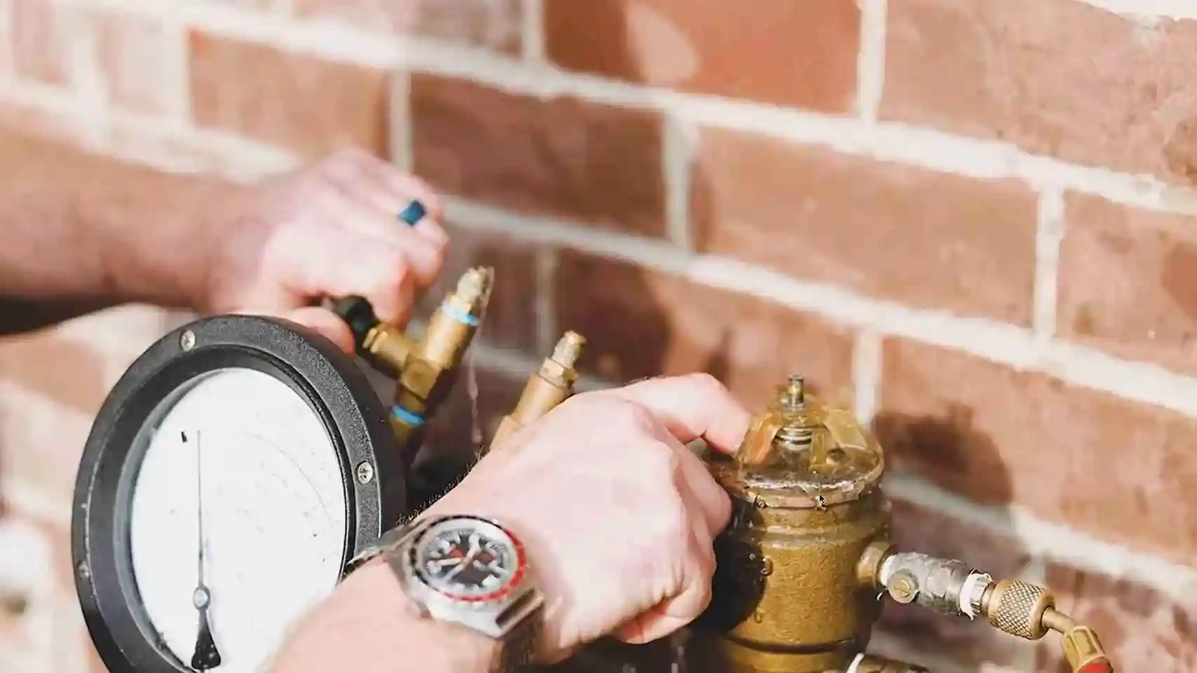 Gauge hose connected to a backflow preventer with water dripping