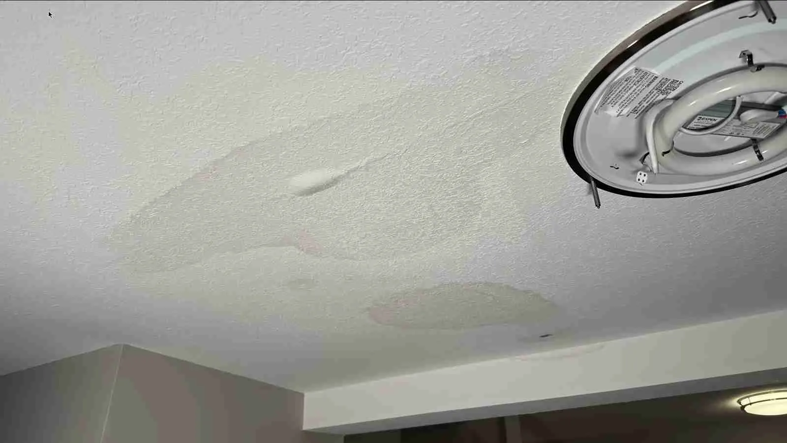 Water-stained ceiling revealing a hidden plumbing leak