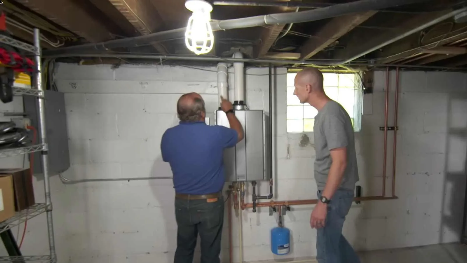 Installer checking the vent on a new tankless water heater
