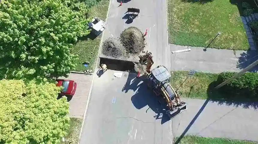 Aerial view of a residential street sewer repair